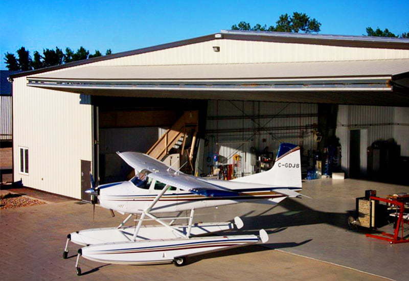 Prefabricated steel airplane hangar for a personal private residence