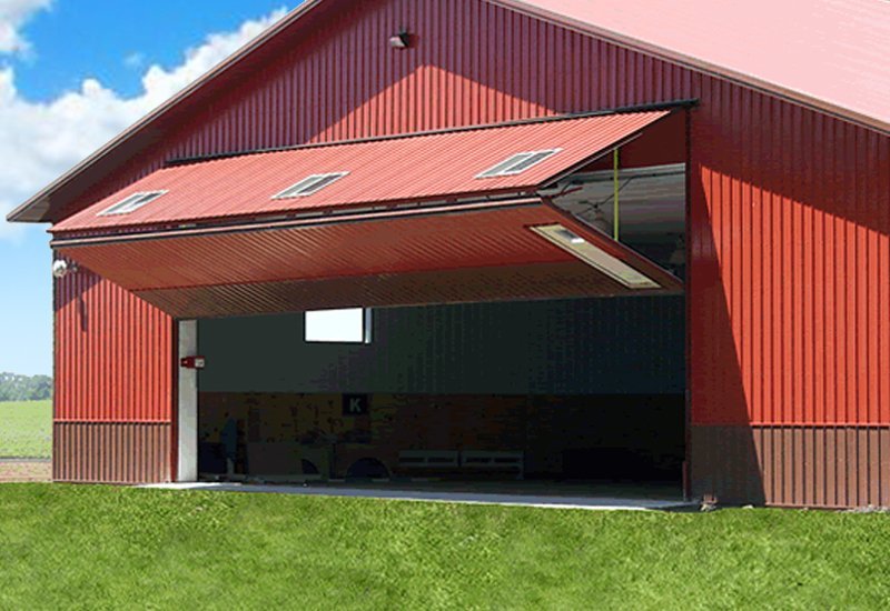Prefab steel agricultural building with bifold door for equipment storage