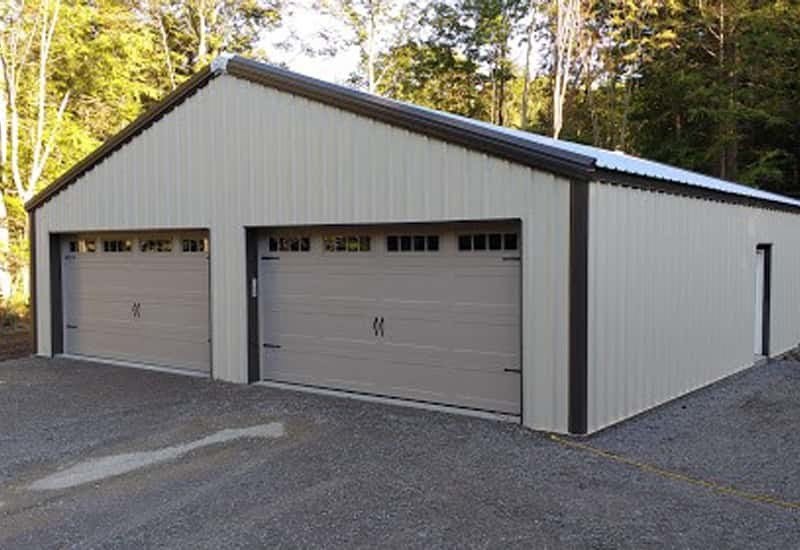 A white prefab steel building residential garage