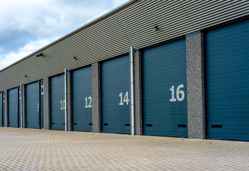 Long view of blue colored steel storage units